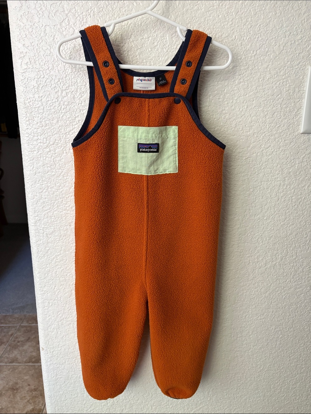 Patagonia Kids Orange Fleece Overalls with Navy Trim and Mint Pocket